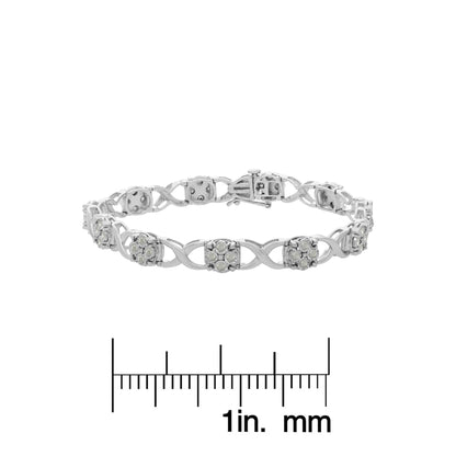 White metal bracelet with round white gemstones in prong settings, displayed flat on a ruler for size reference, shown from a front angle.