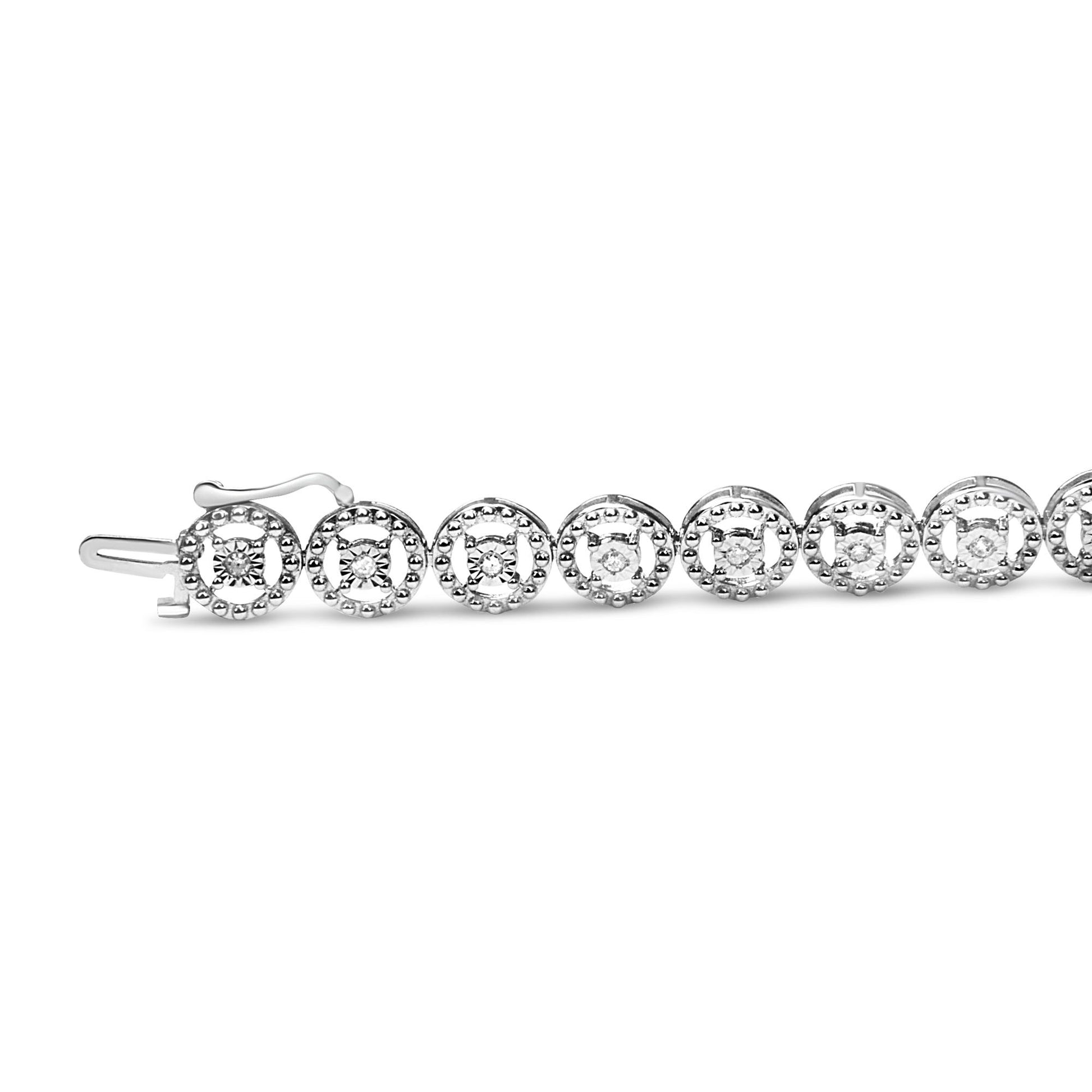 White metal bracelet with round white gemstones in miracle setting, shown flat from a side angle.