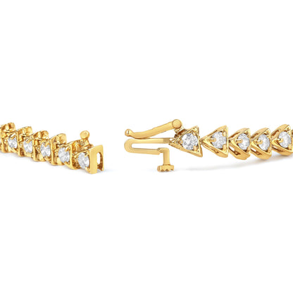 Close-up angled view of an open yellow bracelet with round white gemstones in prong settings.