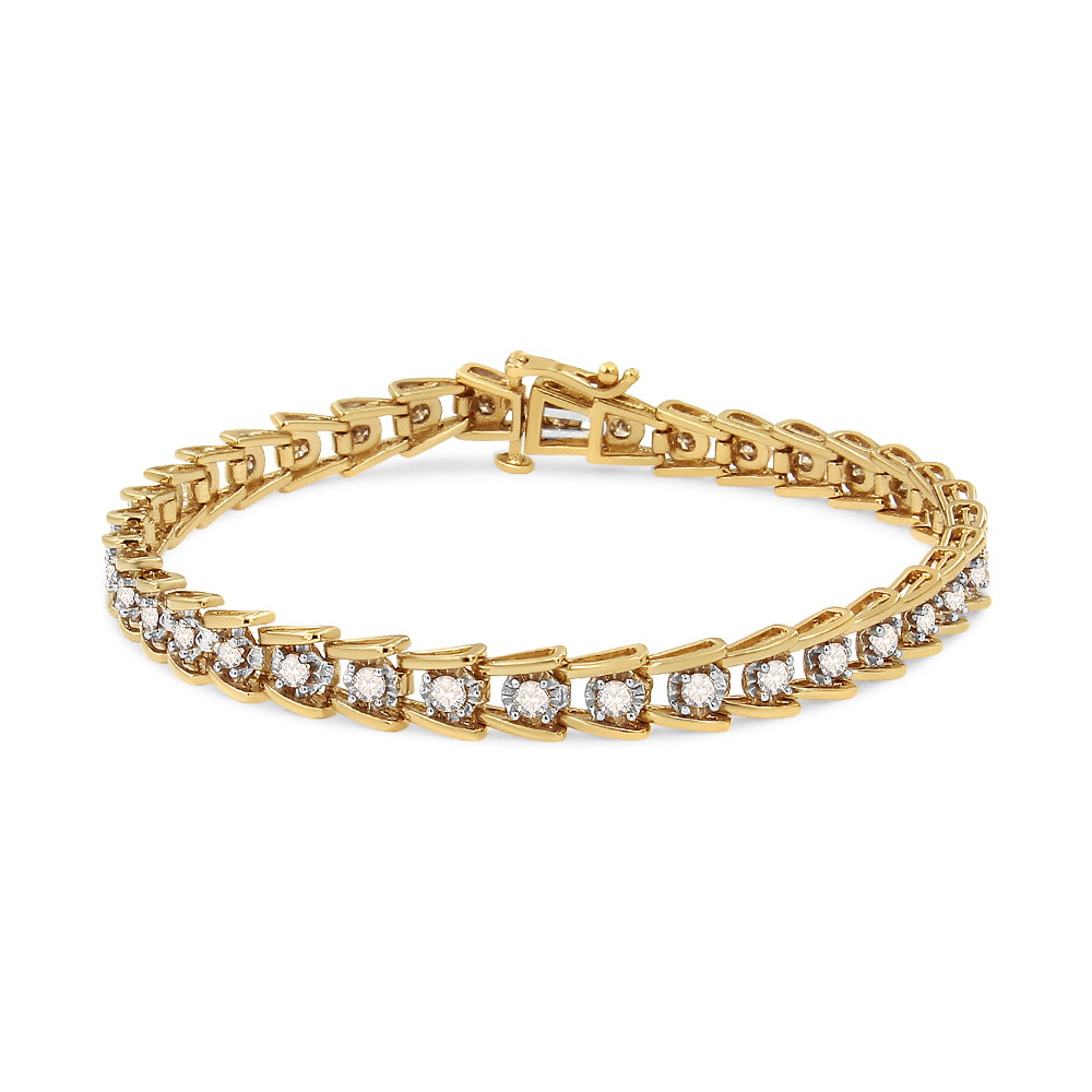 Yellow metal bracelet with round, brownish gemstones in miracle setting, shown at a slight front angle.