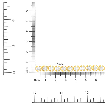 Yellow and white metal bracelet with round white gemstones in prong setting, shown horizontally on a ruler for size reference, top-down angle.