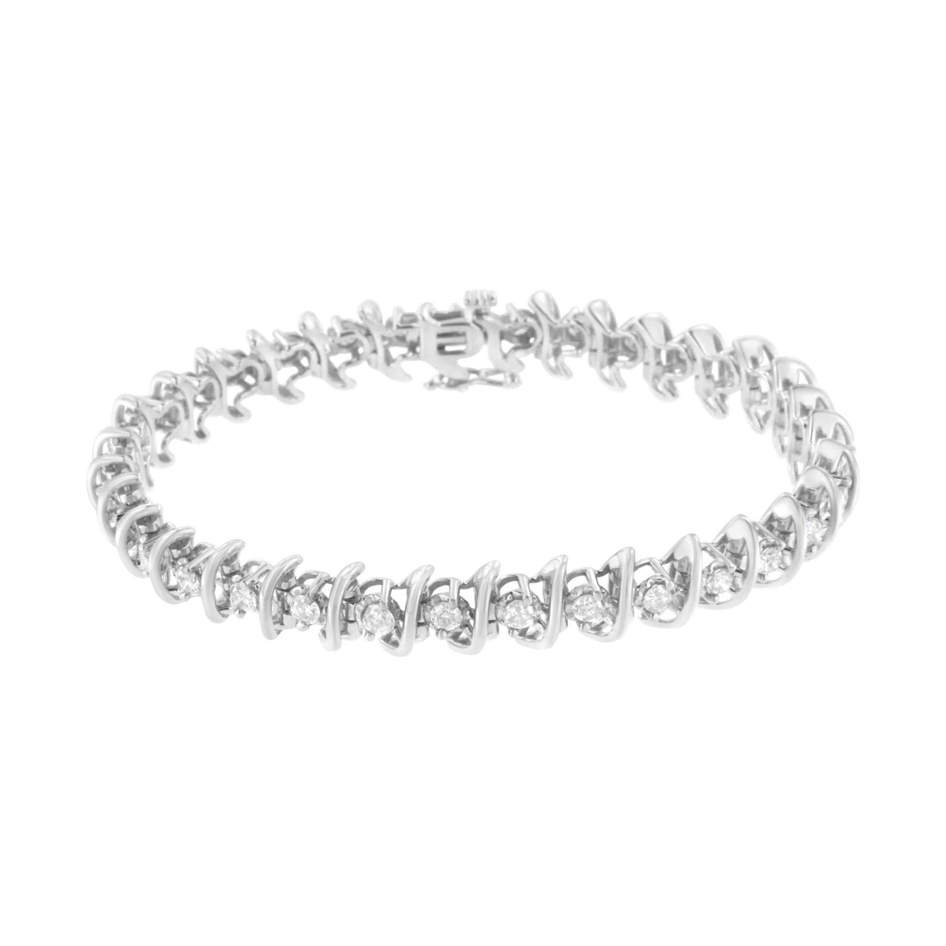 White metal bracelet with alternating small and larger round white gemstones in prong settings, shown from a slightly elevated front angle.