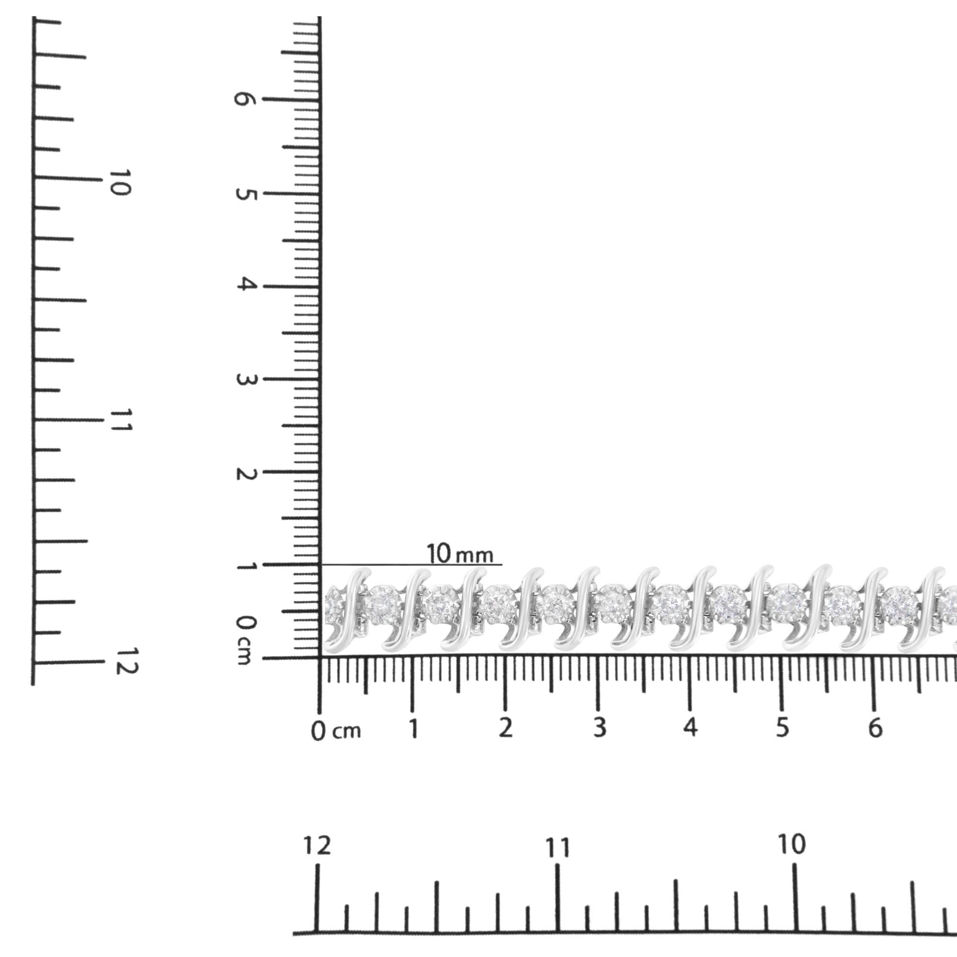 White metal bracelet with round white gemstones in prong settings, displayed on a ruler for size reference, photographed from a top-down angle.