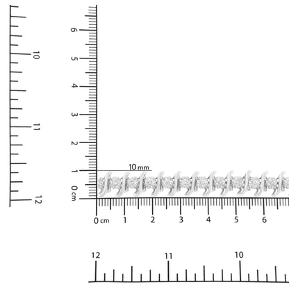 White metal bracelet with round white gemstones in prong settings, displayed on a ruler for size reference, photographed from a top-down angle.