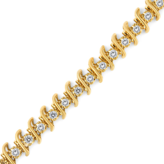 Diagonal close-up of a yellow metal bracelet with round white gemstones in prong settings.