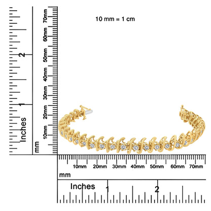 Yellow metal bracelet with round white gemstones in prong settings, displayed on rulers for size reference, angled from side.