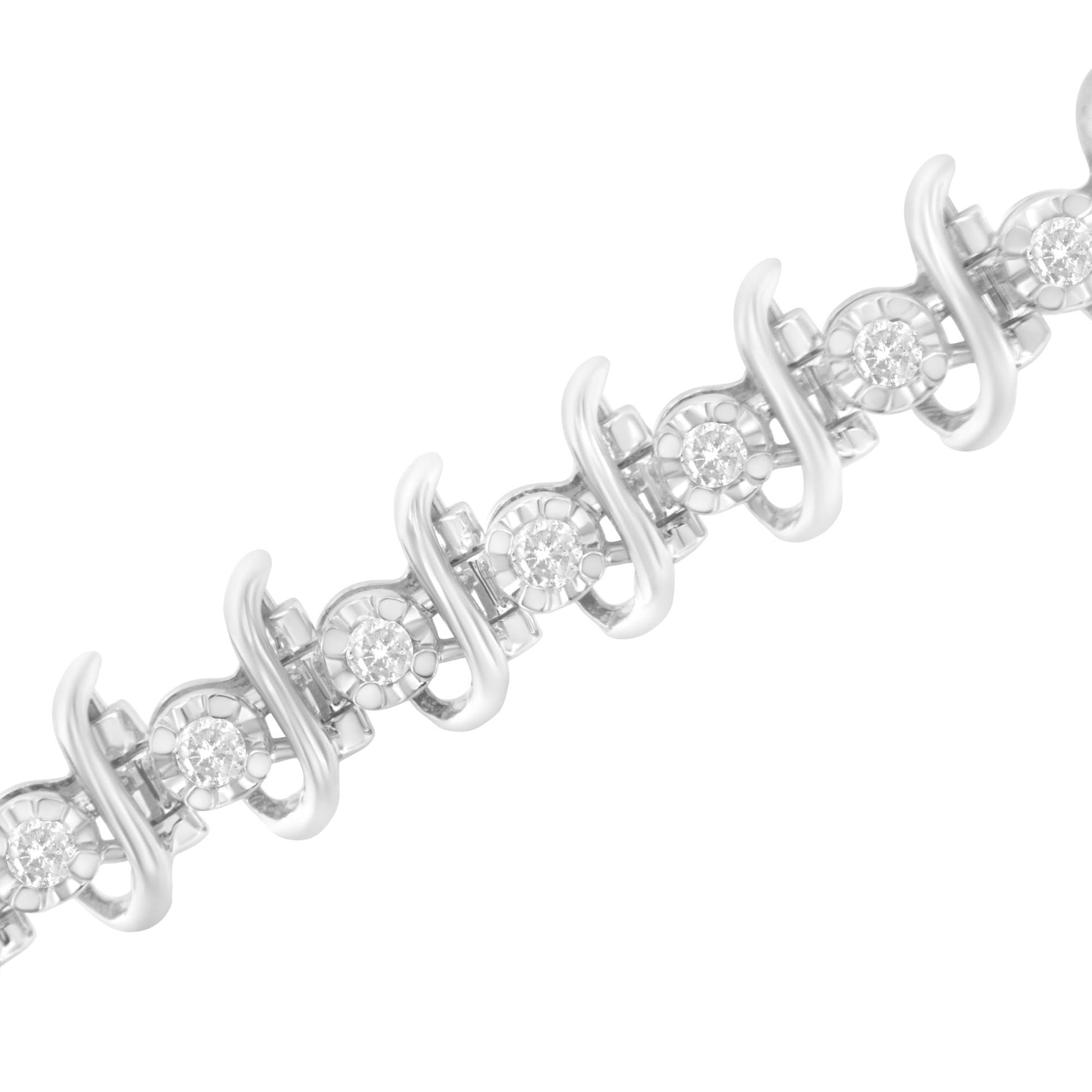 Diagonal close-up of a white metal bracelet featuring round white gemstones in prong settings with a curving design between each gemstone.