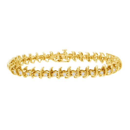 Yellow metal bracelet with round white gemstones in prong settings, shown from a front angle.