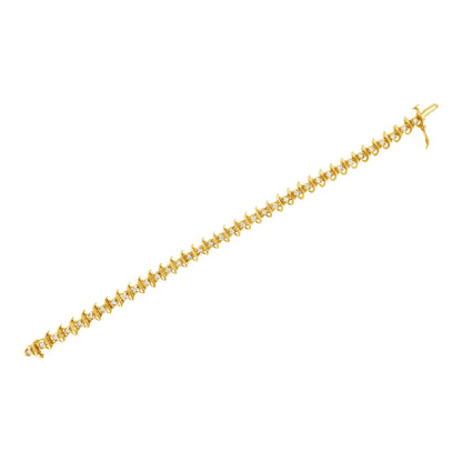 Bracelet shown from a top-down angled view, featuring yellow metal with round white gemstones set in prong settings along the length.