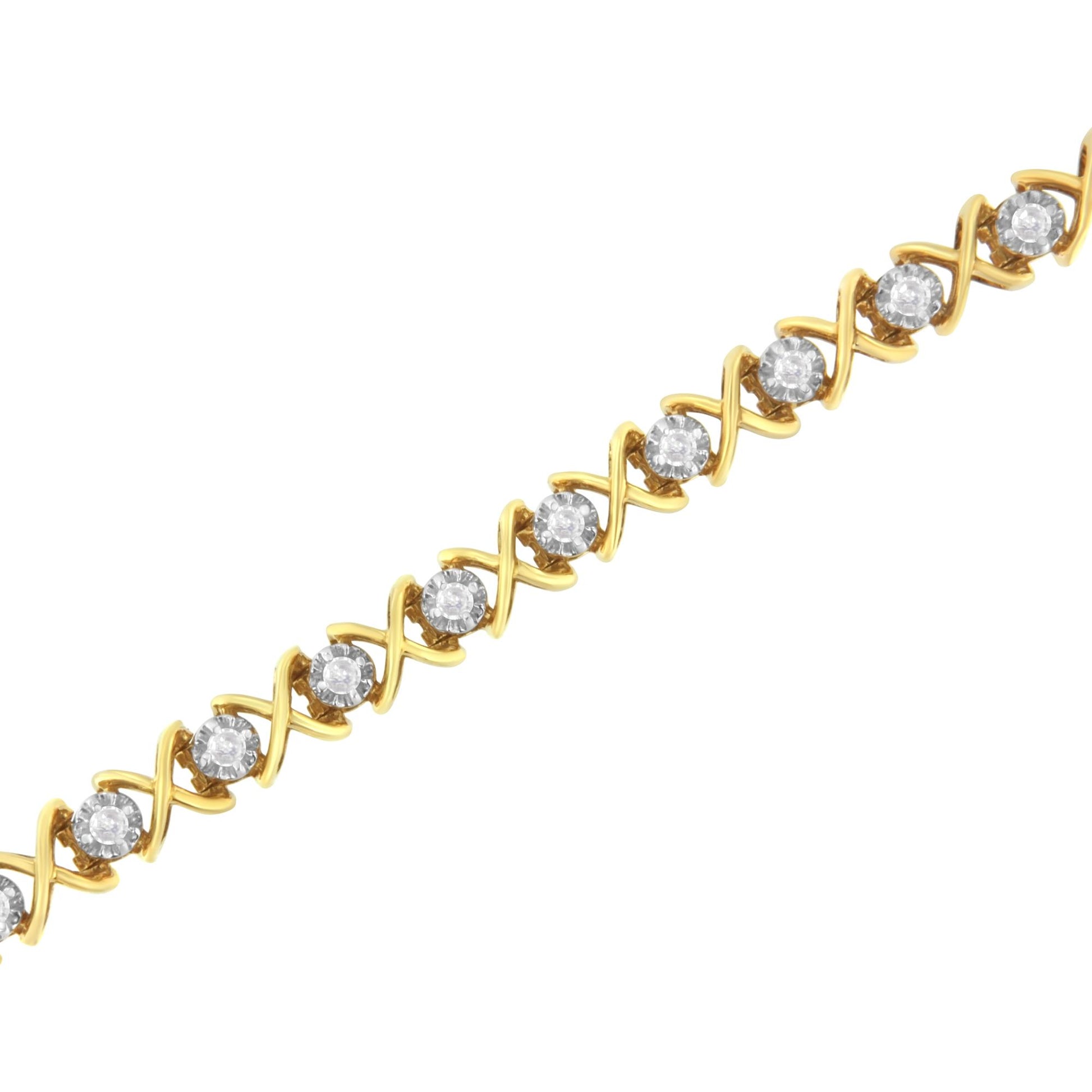 Yellow metal bracelet with round white gemstones in prong settings and crisscross design, shown at an angled close-up.