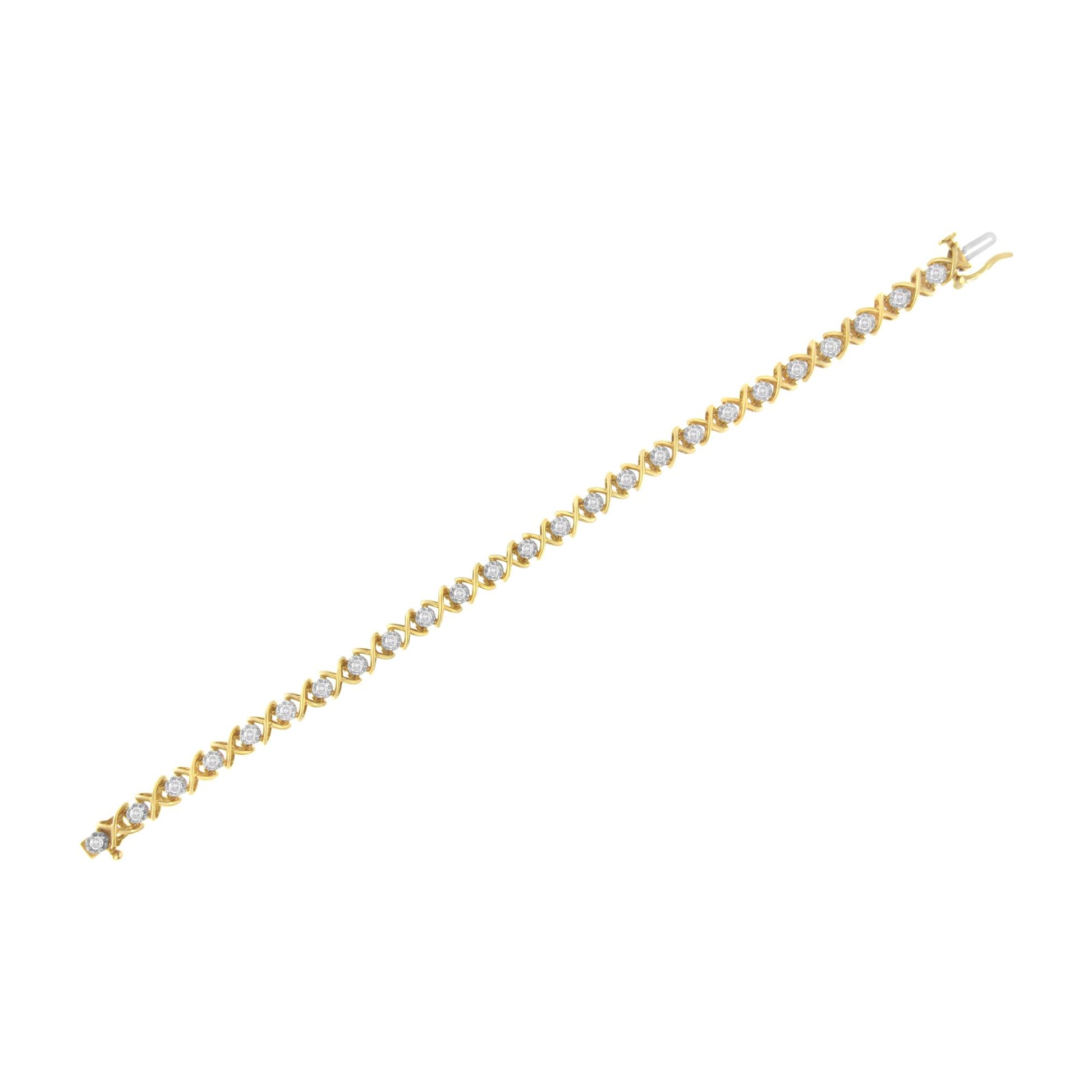 Yellow metal bracelet with round white gemstones in prong settings, shown in a flat lay from a top angle.