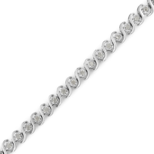 White metal bracelet with round white gemstones set in a wave pattern, shown in a close-up diagonal angle.