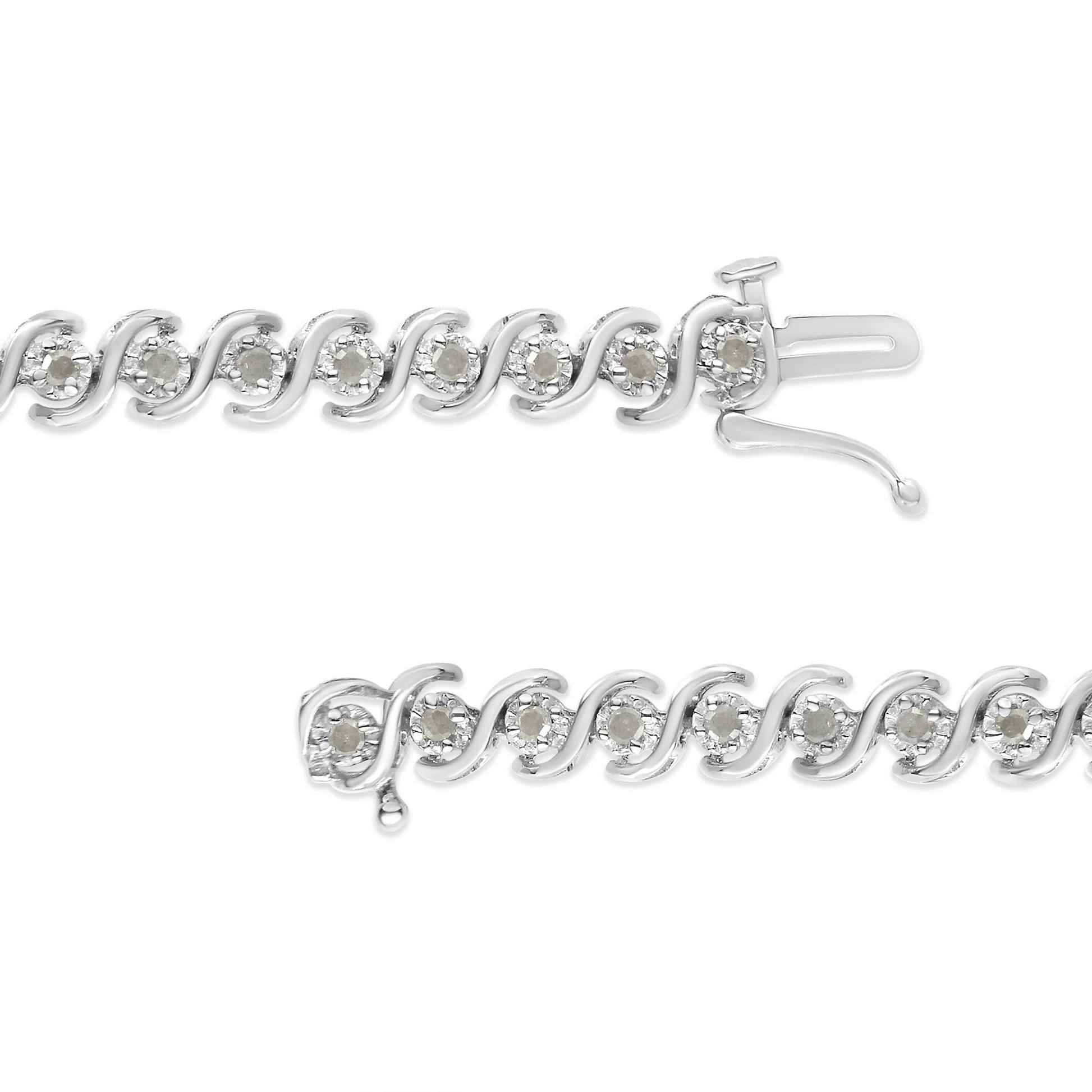 Close-up front view of a white metal bracelet featuring round white gemstones in a miracle setting along the chain, with the clasp open.