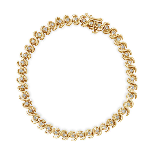 Top-down view of a yellow bracelet with round white gemstones in a miracle setting along the entire piece.