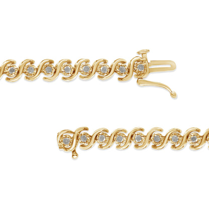 Close-up angled shot of a yellow metal bracelet featuring round white gemstones in a miracle setting throughout the design with a clasp closure shown from two angles.