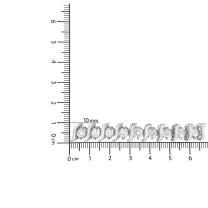 White metal bracelet with alternating curved links and round white gemstones in two-prong settings, laid flat on a ruler for size reference, top-down angle.