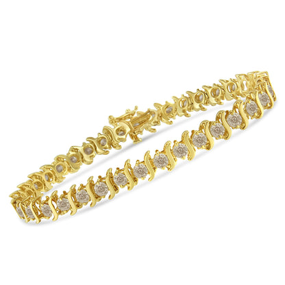 Yellow metal bracelet with round white gemstones in prong settings, shown from a slight side angle.