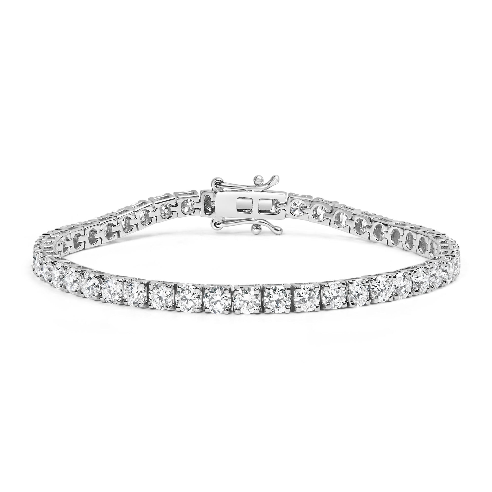 White metal tennis bracelet with round white gemstones in 4-prong settings viewed from front angle showing clasp.