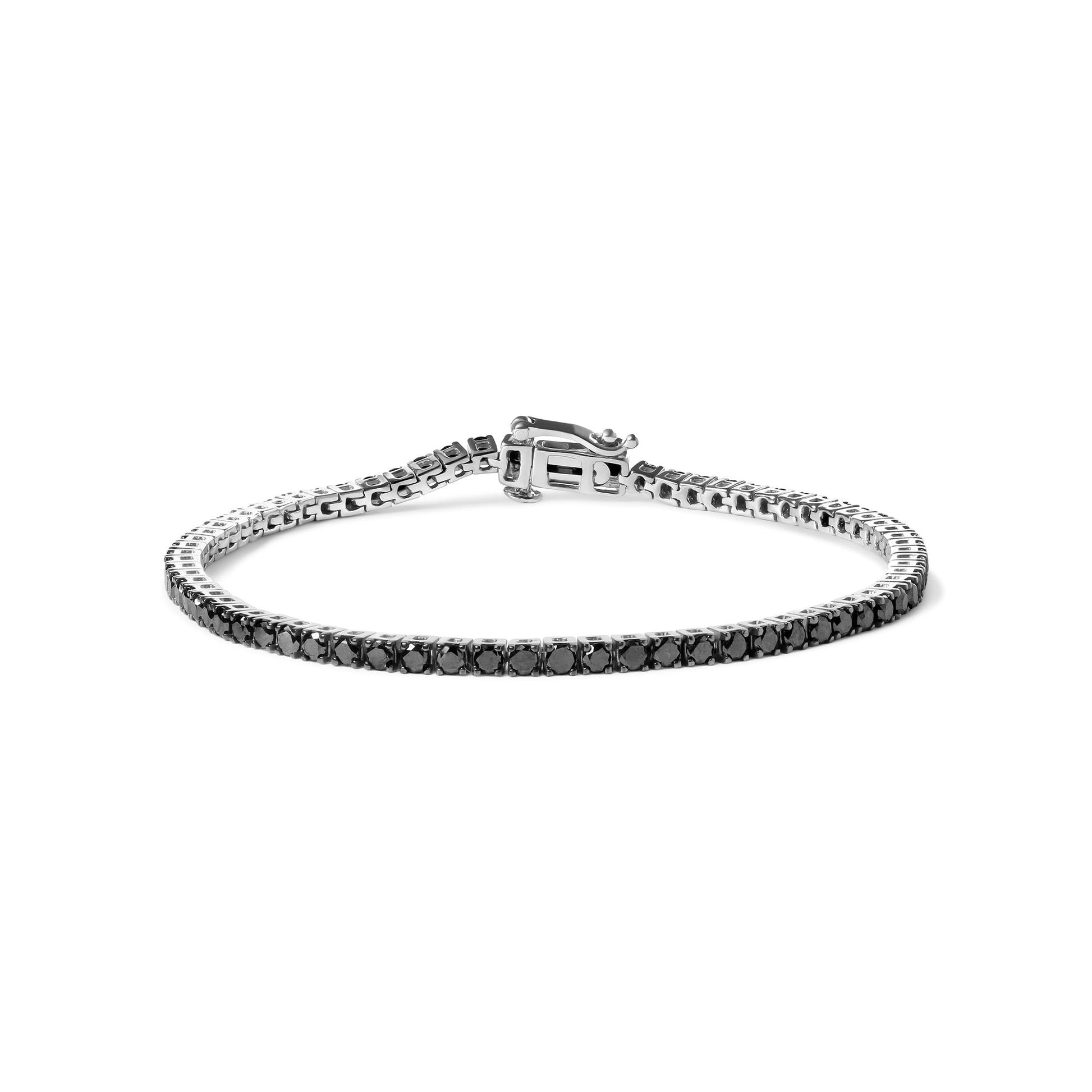 White metal bracelet with round black gemstones in prong setting, shown from a front angle on a white background.