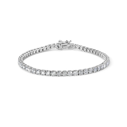 White metal bracelet with round white gemstones in 4-prong settings, shown flat with clasp visible, photographed from a slightly elevated angle.