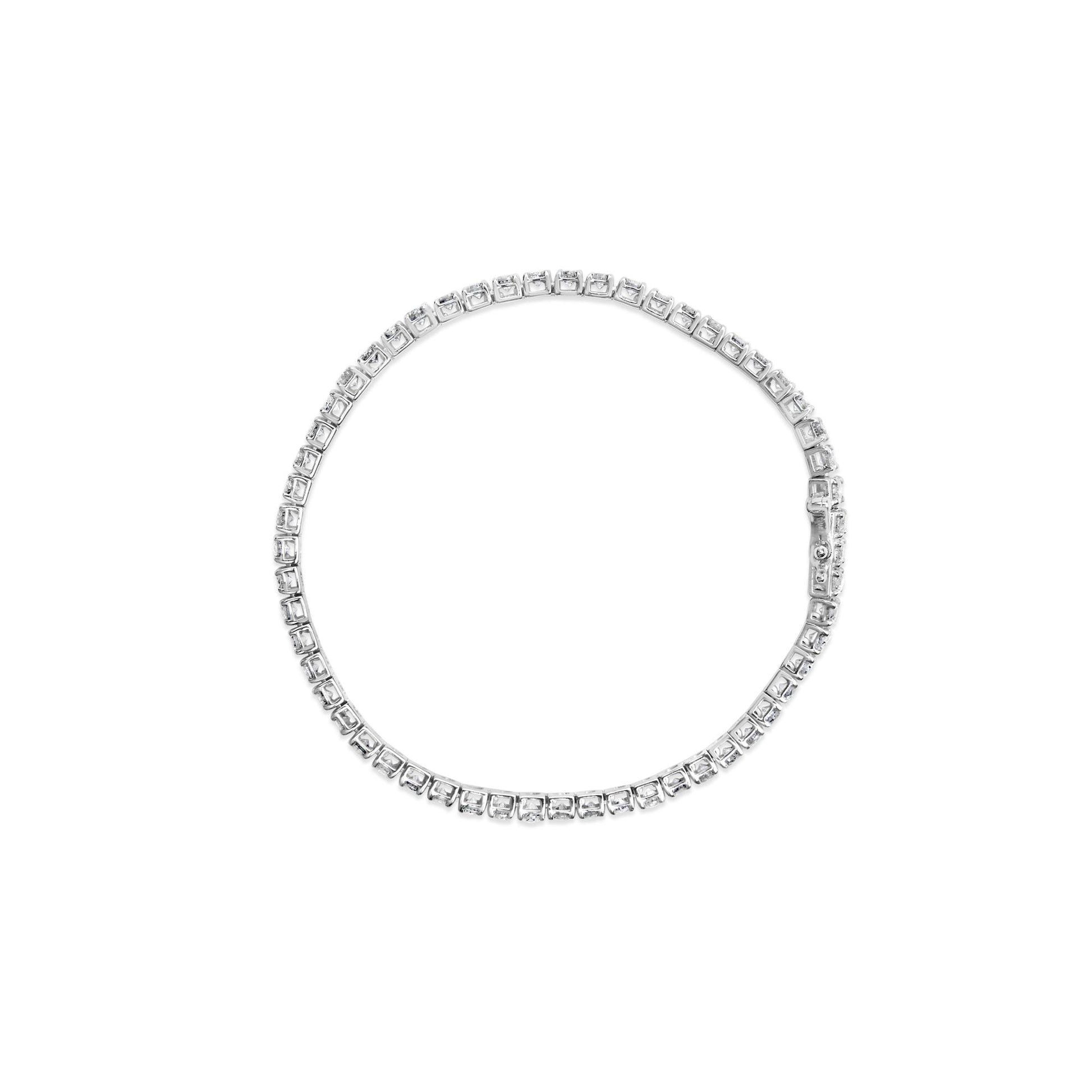 Top view of a white bracelet with round white gemstones set in 4-prong settings forming a continuous circle, shown on a white background.