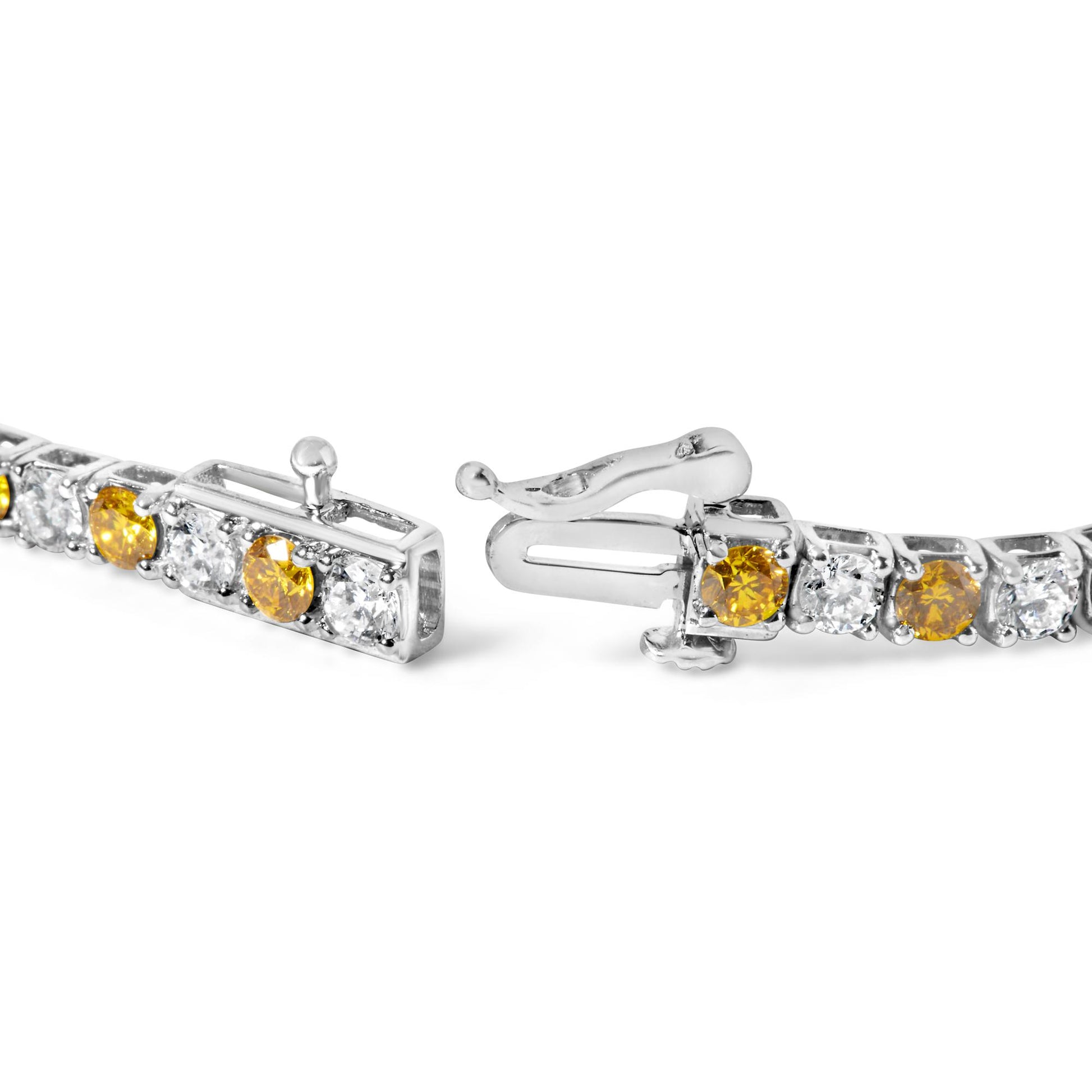 Close-up image of a white metal bracelet clasp with alternating yellow and white round gemstones in a 4-prong setting shown from a front side angle.