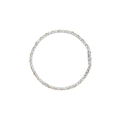 Top-down view of a white bracelet featuring alternating yellow and white round gemstones in 4-prong settings encircling the piece.