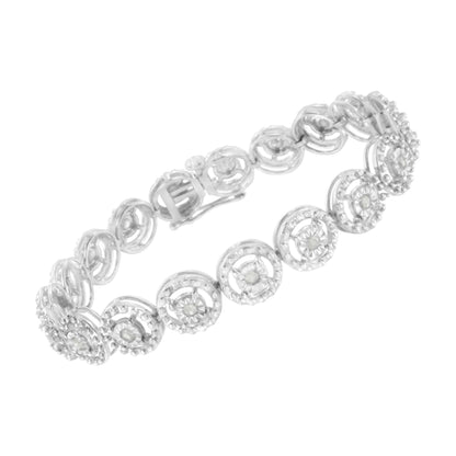 White metal bracelet with circular links featuring prong-set round white gemstones, shown at an angled top-down view.