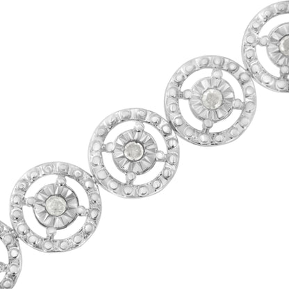 White metal bracelet with linked circular segments, each featuring a central round white gemstone in prong setting, close-up angled view.