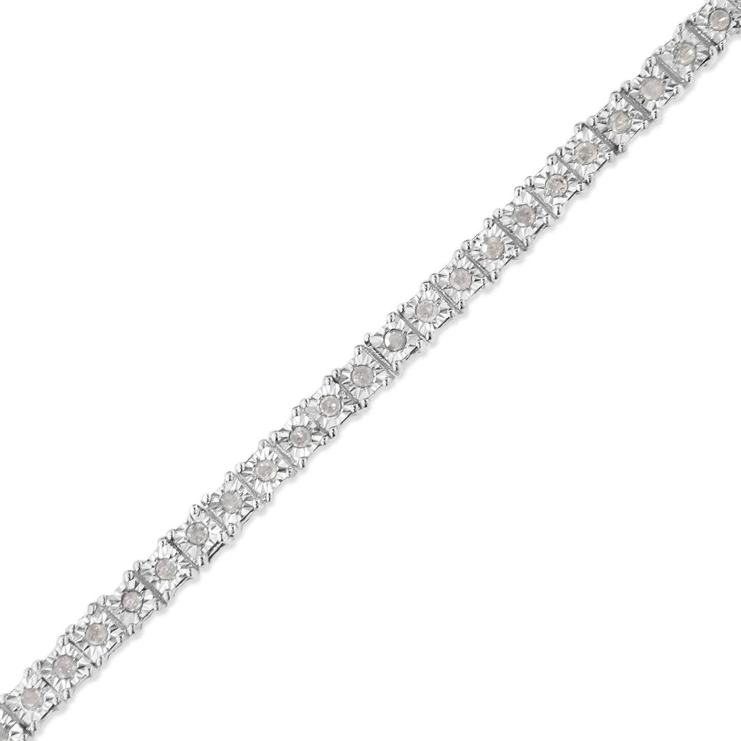 Diagonal close-up of a white metal bracelet with round white gemstones in a miracle setting.