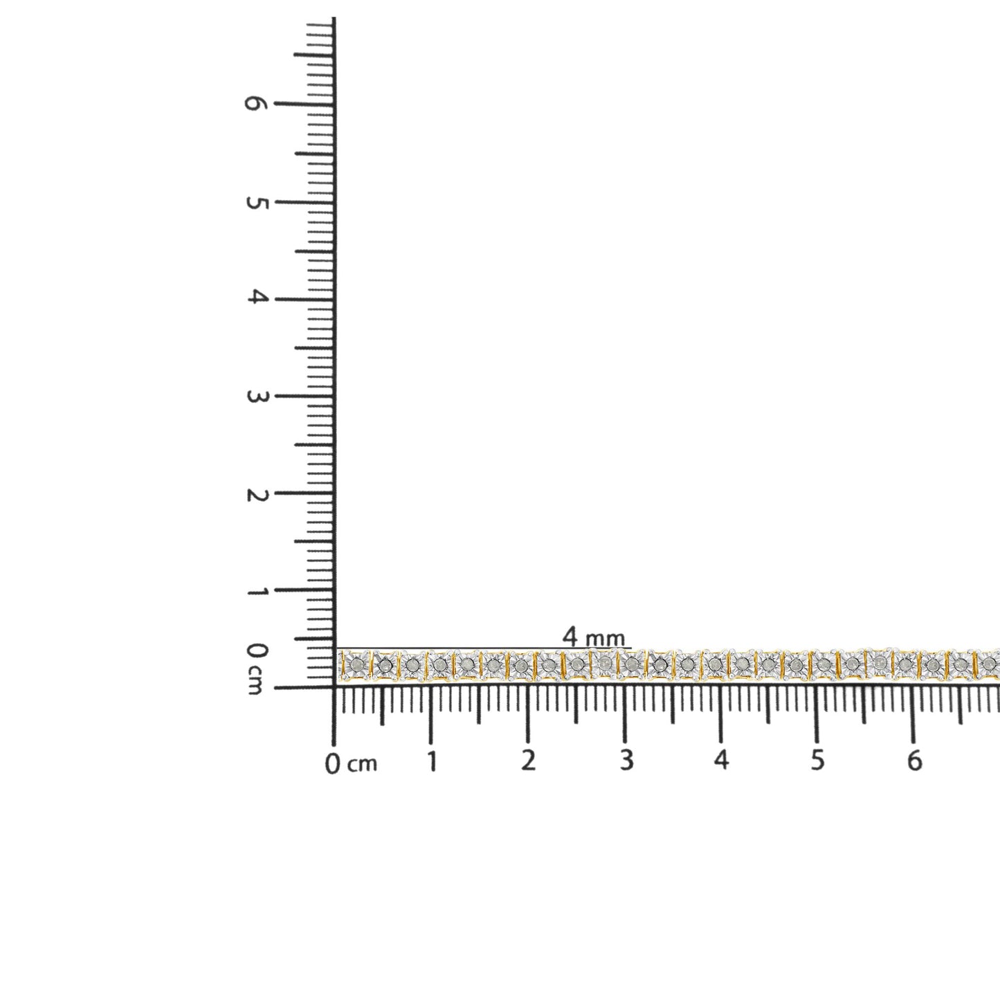 Yellow metal bracelet with round white gemstones in miracle setting, placed on a ruler for size reference, top-down angle.