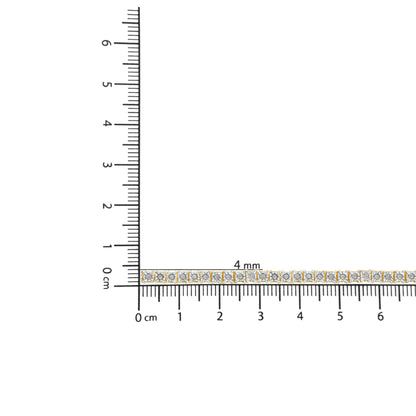 Yellow metal bracelet with round white gemstones in miracle setting, placed on a ruler for size reference, top-down angle.