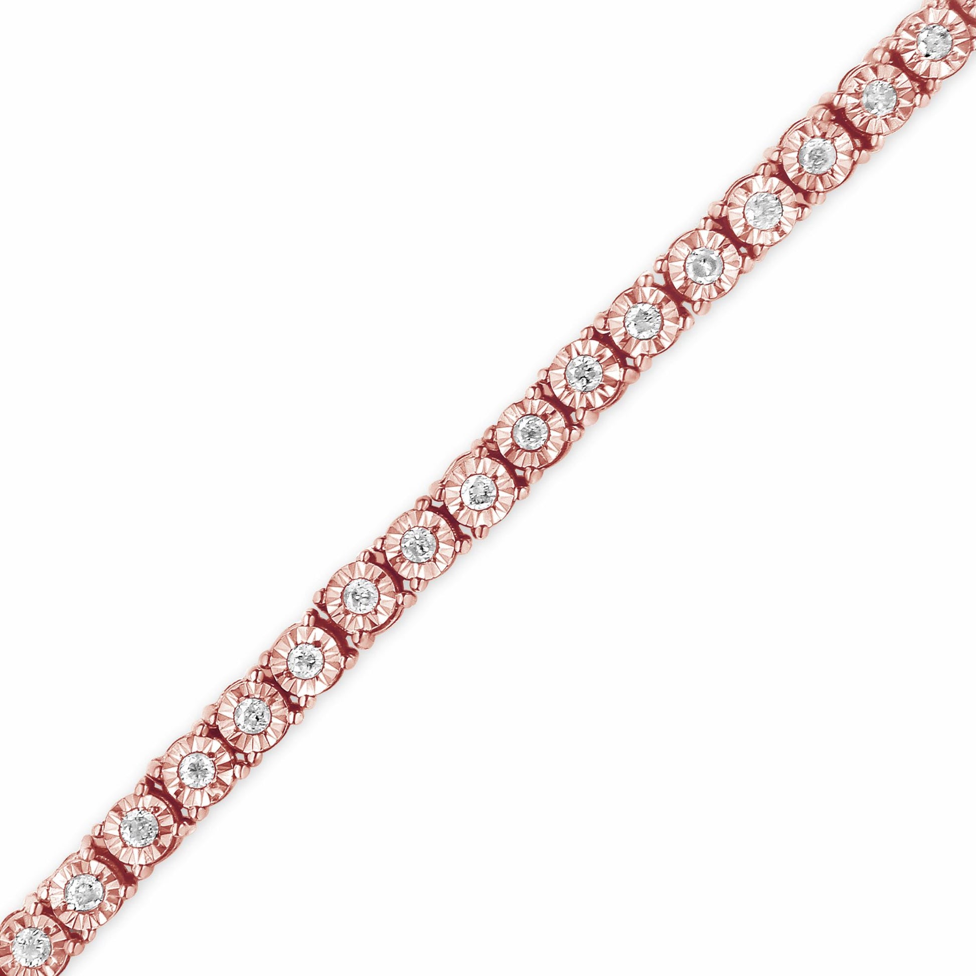 Close-up angled view of a rose-colored bracelet with round white gemstones set in a floral-inspired pattern.