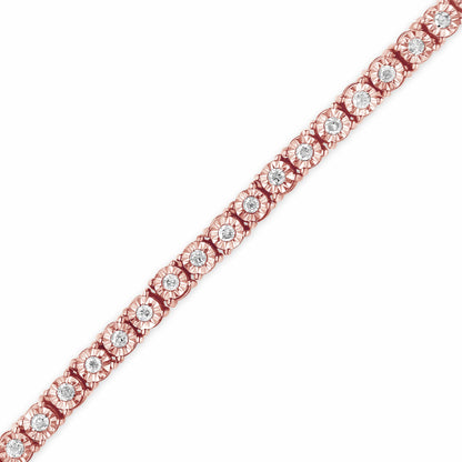 Close-up angled view of a rose-colored bracelet with round white gemstones set in a floral-inspired pattern.