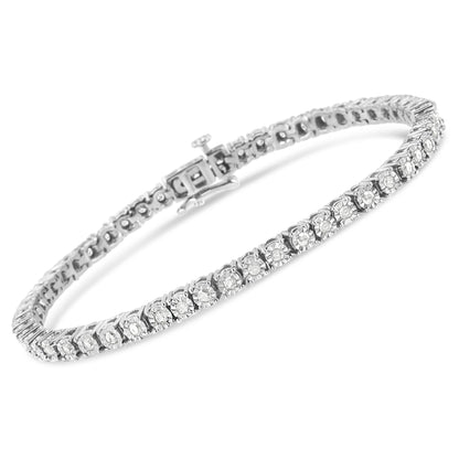 White metal bracelet with round white gemstones in miracle setting, shown at an angled top view.