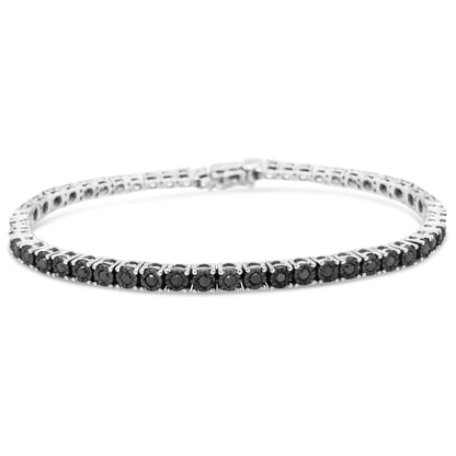 White bracelet with round black gemstones in miracle setting, shown from a low front angle.