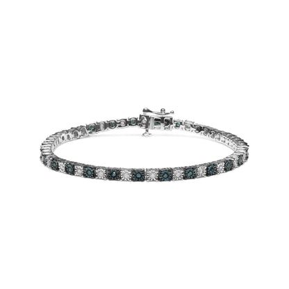 White metal bracelet with alternating blue and white round and rose-shaped gemstones in miracle settings, shown from a front angle with clasp visible.