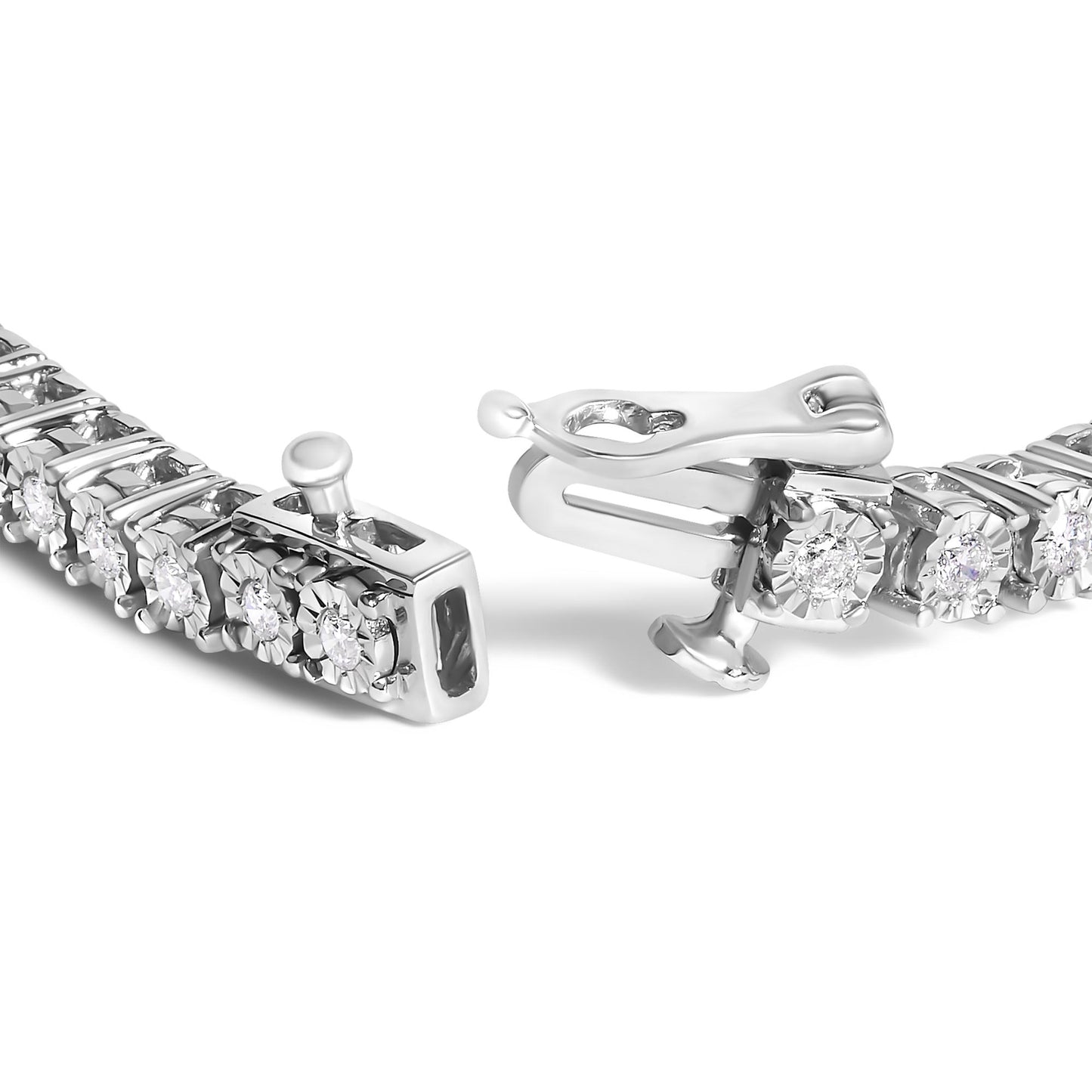 Close-up angle of a white metal bracelet with round white gemstones in miracle settings, focusing on the clasp.