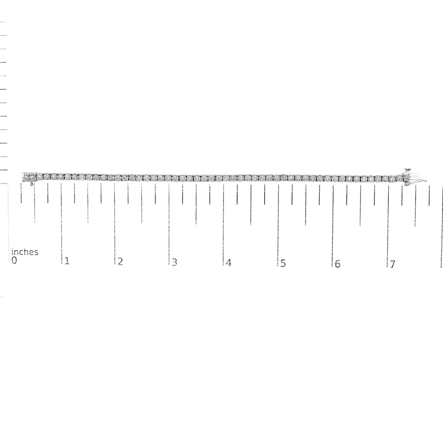 White metal bracelet with round white gemstones in miracle setting, laid flat on a ruler for size reference, shot from above.