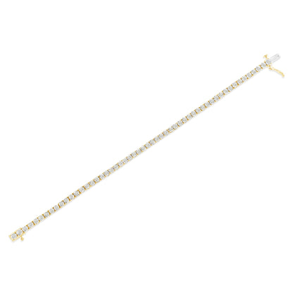 Yellow metal bracelet with round white gemstones in miracle setting, shown in a flat, diagonal top-down view.