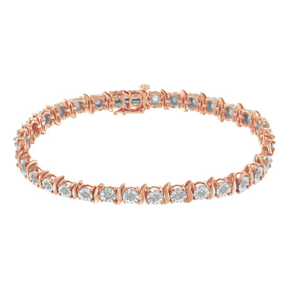 Close-up front angle of a rose-colored metal bracelet with round white gemstones in a continuous setting.