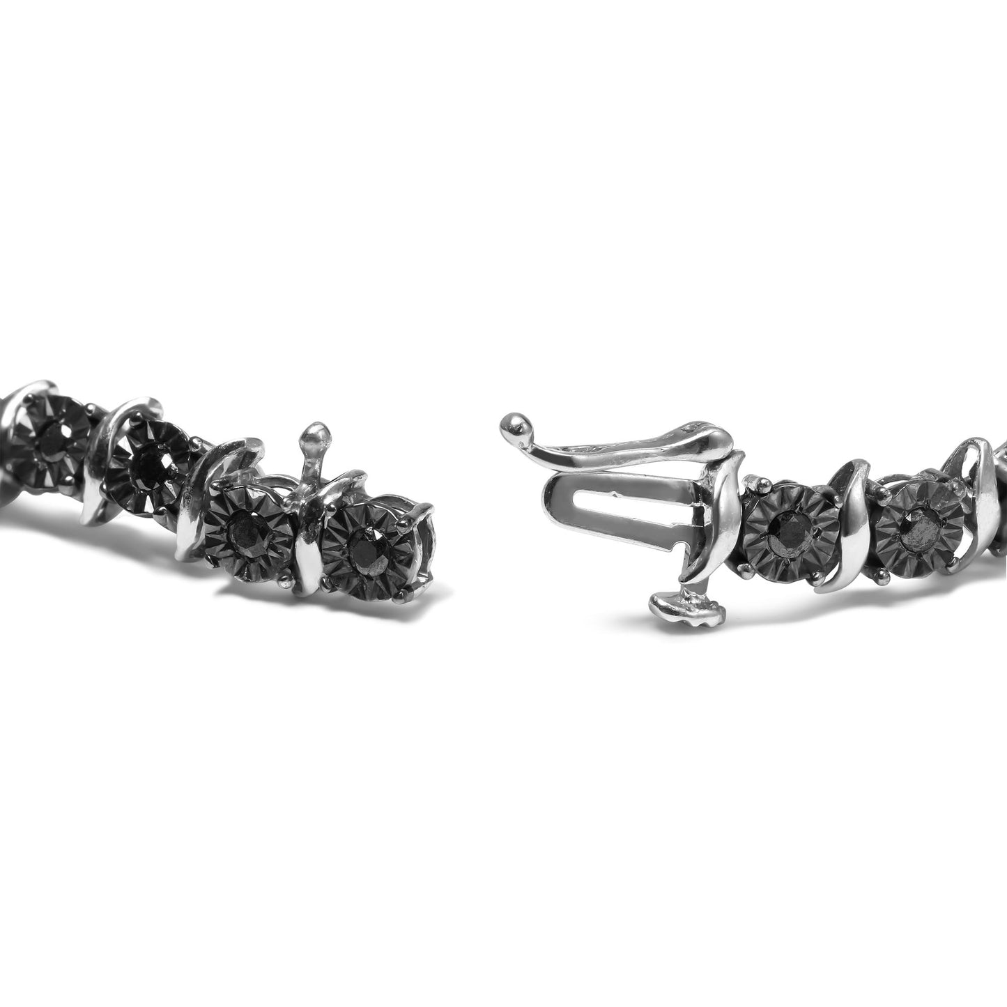 Close-up front angle of a white metal bracelet with round black gemstones set in a unique setting, showing the clasp open.