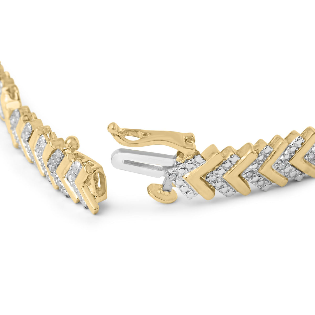 Close-up angled view of a bracelet with a yellow and white metal design featuring round white gemstones in prong settings along a zigzag pattern, shown unclasped on a white surface.