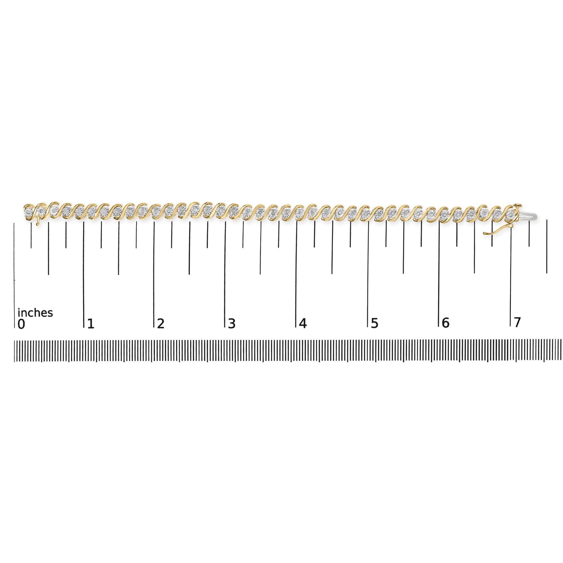 Bracelet with alternating yellow and white metal links each set with round white gemstones, laid flat on a ruler for size reference, shot from above.