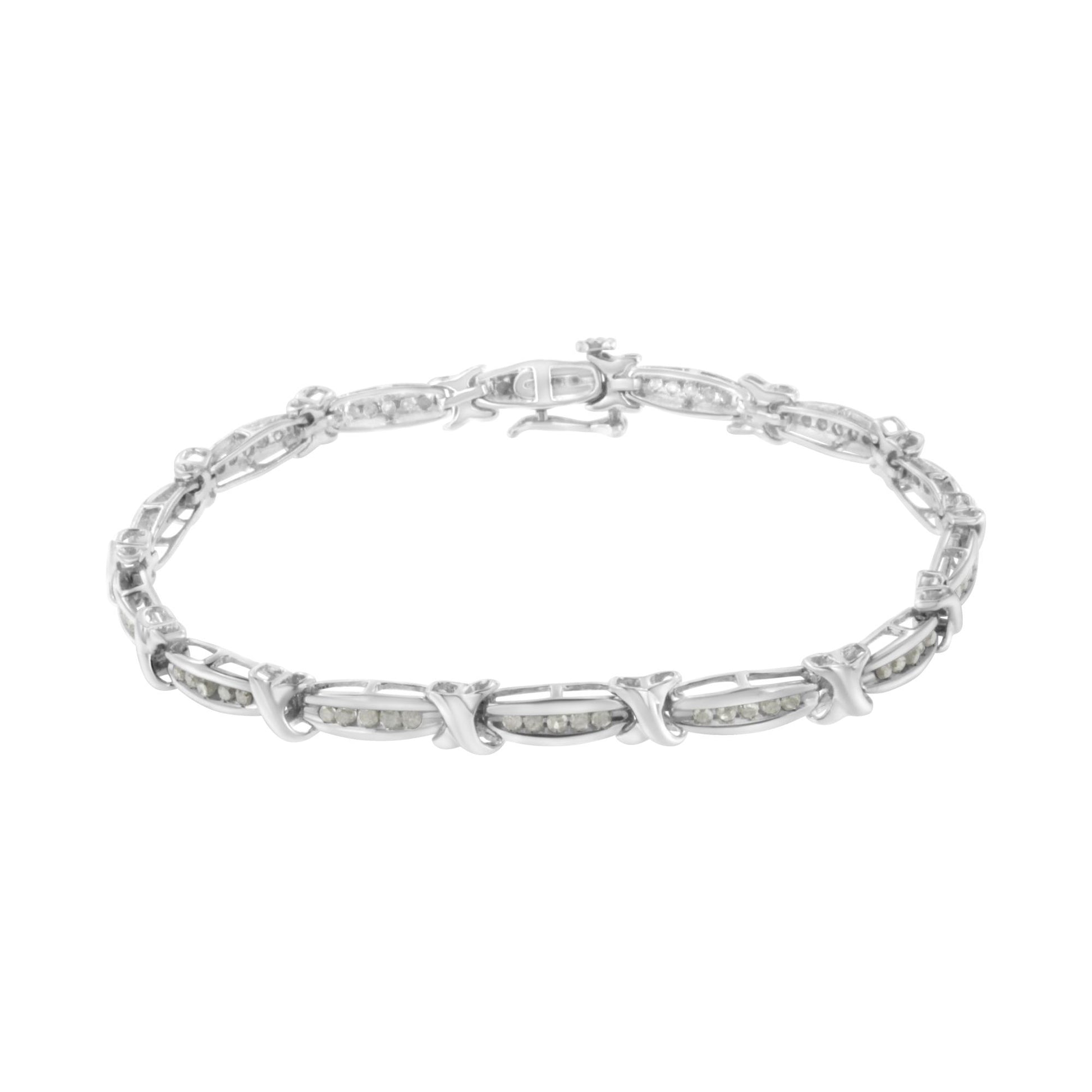 White metal bracelet with round white gemstones in a channel setting, shown from a front angle on a white background.