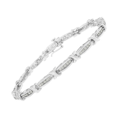 White metal bracelet with oval links featuring channel-set round white gemstones, shown at an angled top-down view.