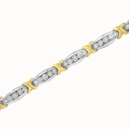 Close-up, angled view of a yellow and white metal bracelet featuring round white gemstones in a miracle setting.