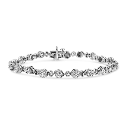 White metal bracelet with round white gemstones in prong and cluster settings, shown from front angle on a white background.