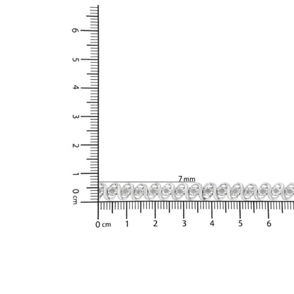 White metal bracelet with round white gemstones in miracle setting, shown flat on a ruler for size reference, top-down angle.
