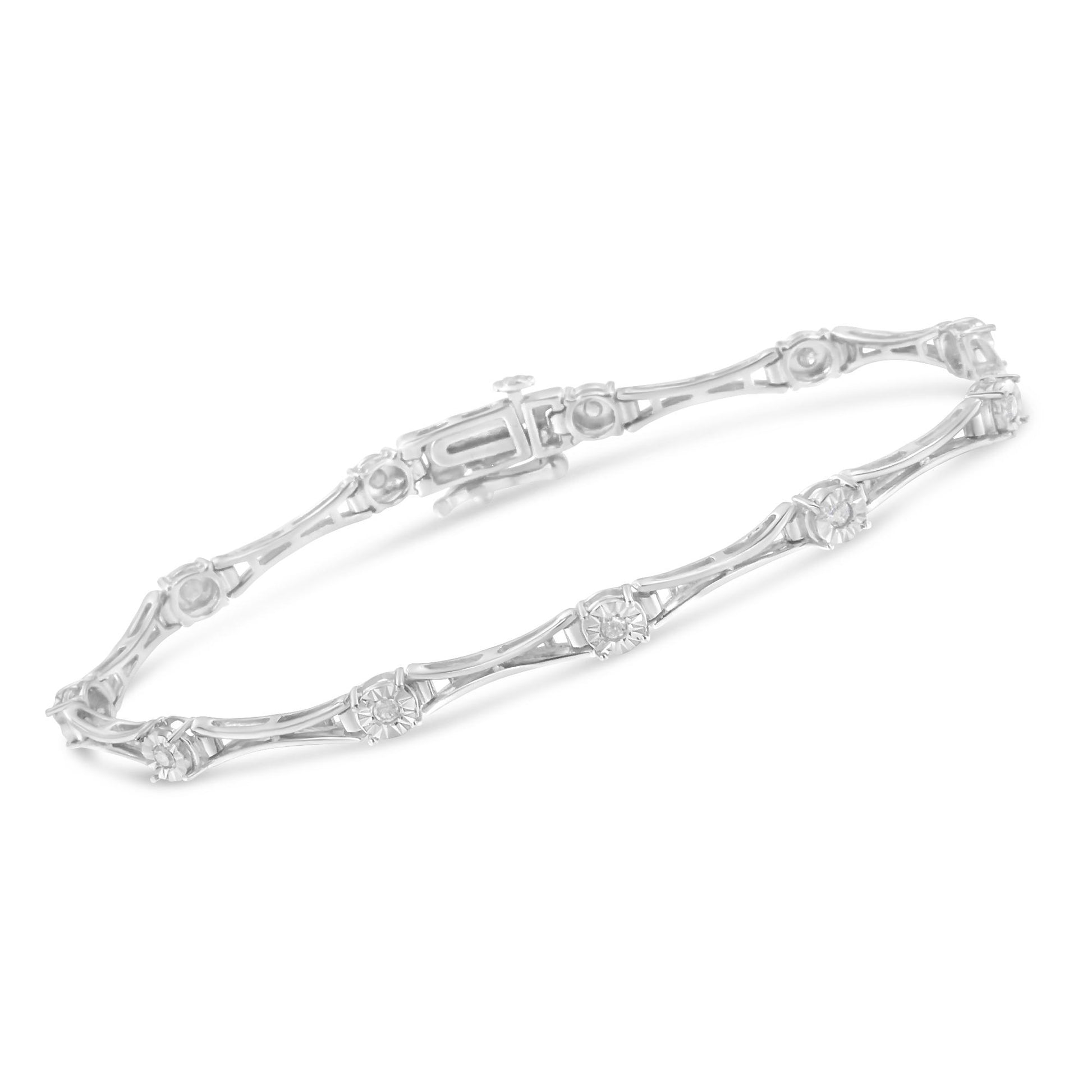 White metal bracelet with round white gemstones in miracle setting, shown from a top angle on a white background.